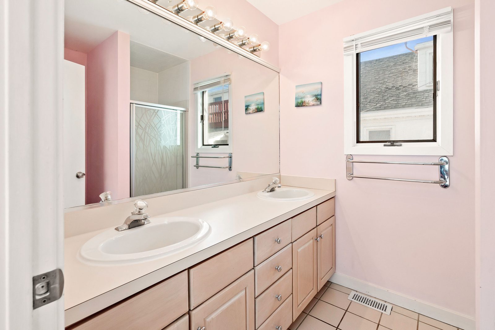Full bathroom with double vanity and glass shower