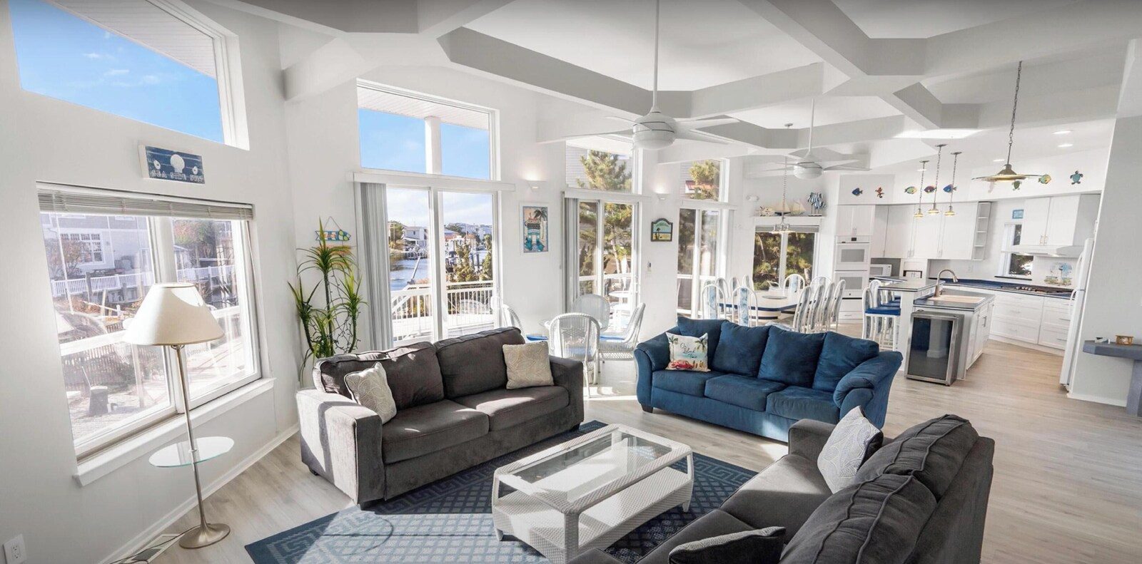 Spacious living area with large sofa and open dining space