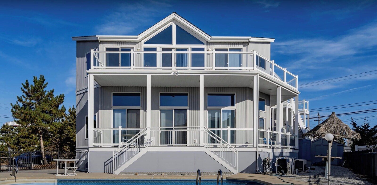 Exterior with balcony and in-ground pool